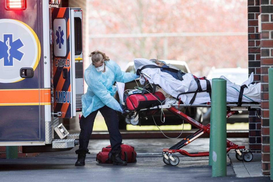First responders load a patient into an ambulance from a nursing home on April 17, 2020 in Chelsea, Massachusetts.