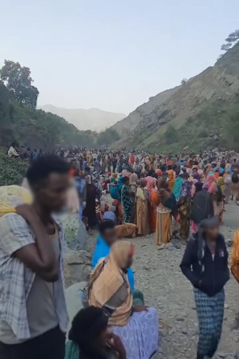 Screenshot of a TikTok video showing a group of migrants