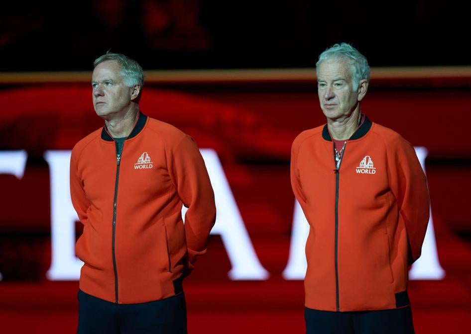 Patrick McEnroe (left) and John McEnroe Jr. arrive on court for the opening of the Laver Cup tennis event, London, September 23, 2022.