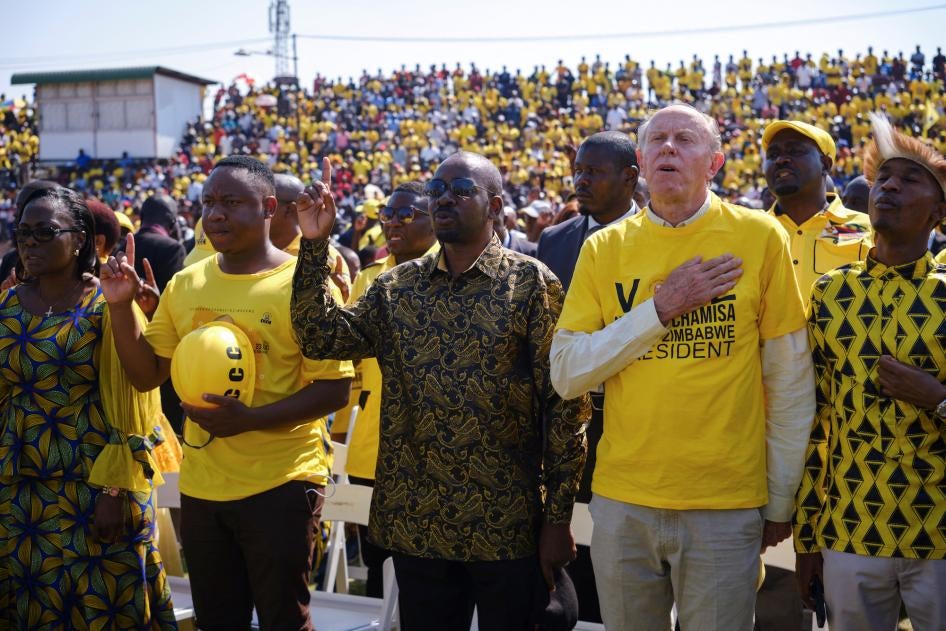 Takudzwa Ngadziore (second from left) and other leaders of the opposition Citizens Coalition for Change (CCC) sing the national anthem during a campaign rally in Bulawayo, Zimbabwe, August 20, 2023. 