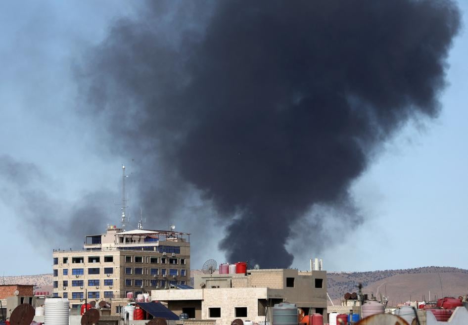 Smoke rises from Syria's Kurdish-controlled northeast city of Qamishli, Syria October 5, 2023. 