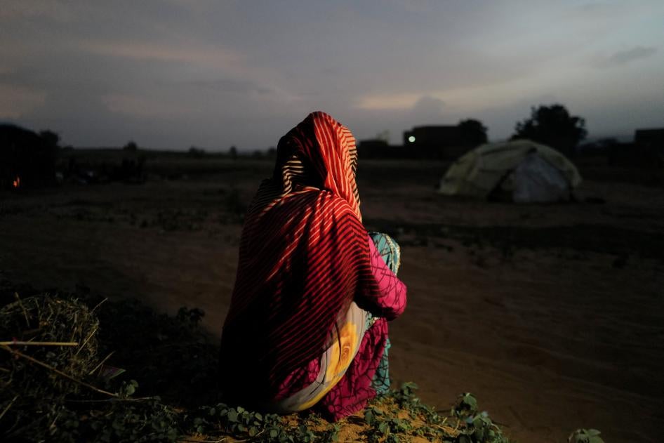 A 24-year-old woman, who said she was raped by militiamen in El Geneina, West Darfur, sits outside a makeshift shelter in Adre, Chad, July 21, 2023. 
