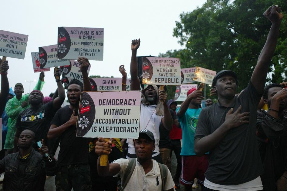 Protesters hold placards during a demonstration in Accra, Ghana against deteriorating economic conditions and fund mismanagement  in the country, on September 22, 2023. (c) 2023  NIPAH DENNIS/AFP via Getty Images