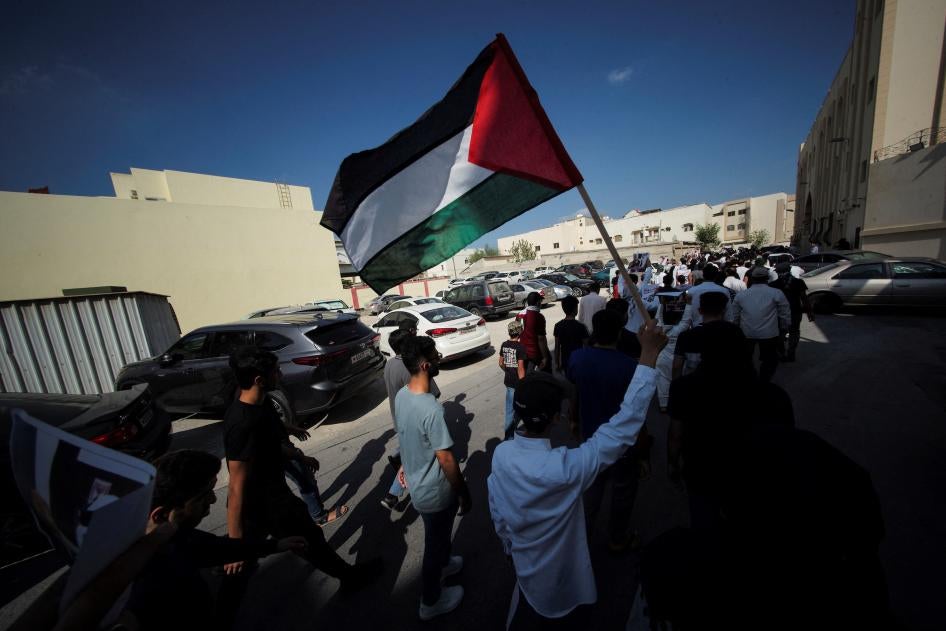A demonstrator holds a Palestinian flag during a protest in support of Palestinians in Gaza, in Diraz, Bahrain, October 27, 2023. 
