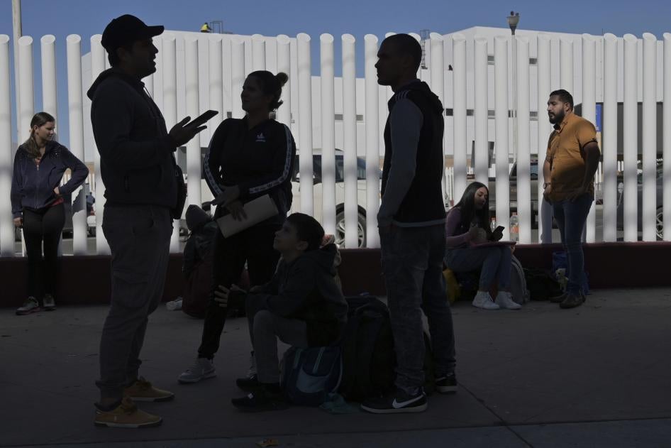 Asylum seekers wait at the US-Mexico border