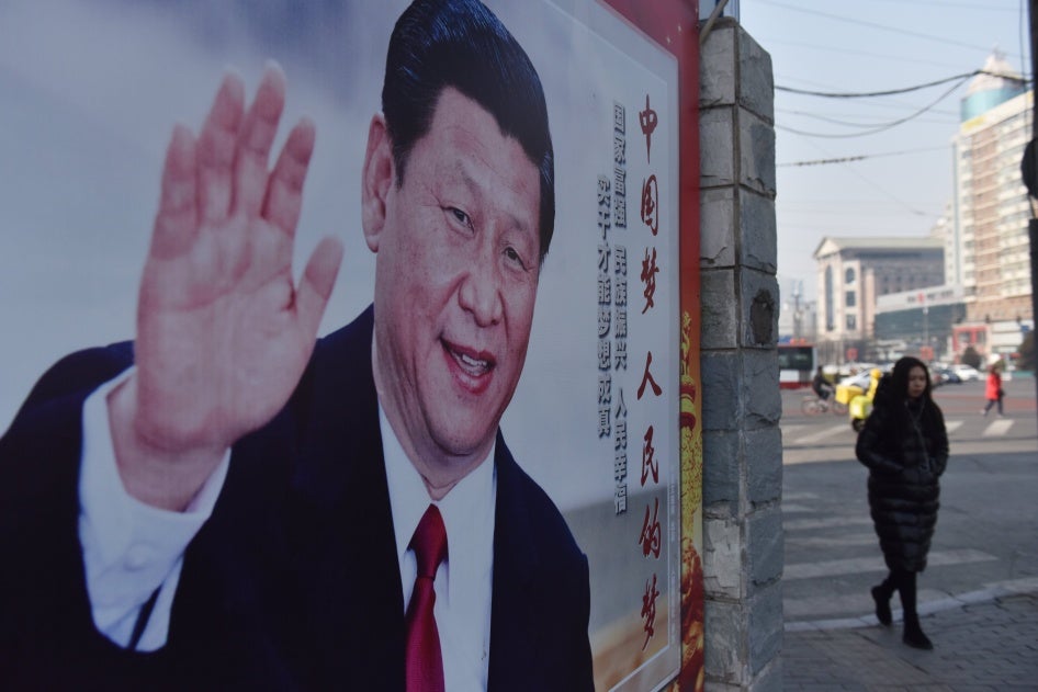 A poster of Chinese President Xi Jinping on a street in Beijing on February 26, 2018