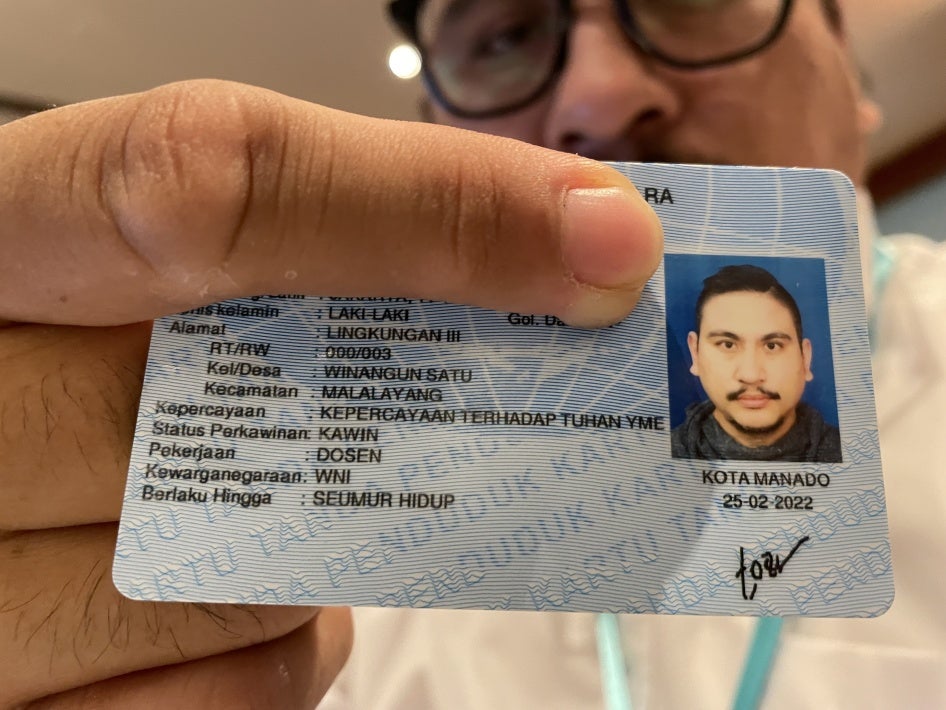  In Indonesia, a believer in Judaism shows his new ID card with the religious column, "Belief in the one God."