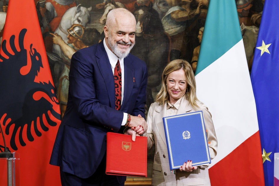 Albania's Prime Minister Edi Rama (L) and Italy's Premier Giorgia Meloni shake hands after the signing of a memorandum of understanding on migrant detention centers during a meeting in Rome, Italy, November 6, 2023.