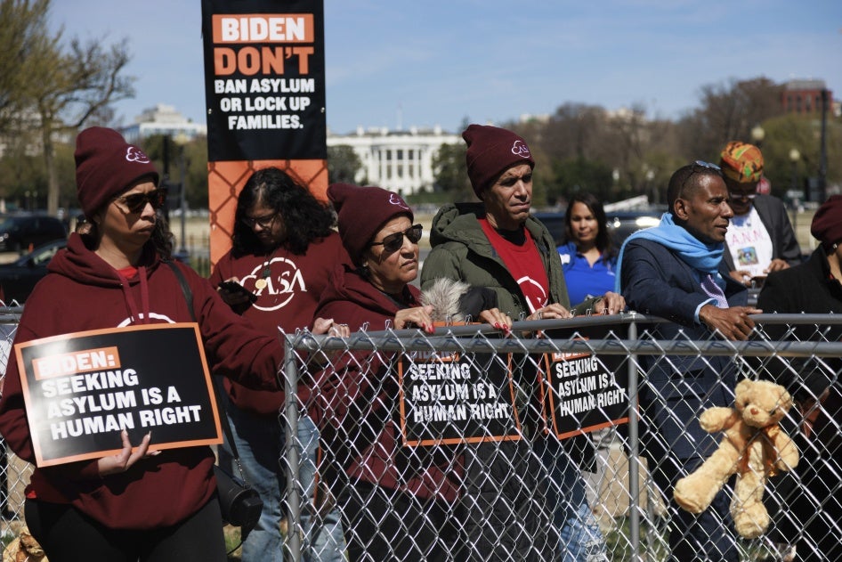 Demonstrators gather near the White House in Washington, DC for a protest