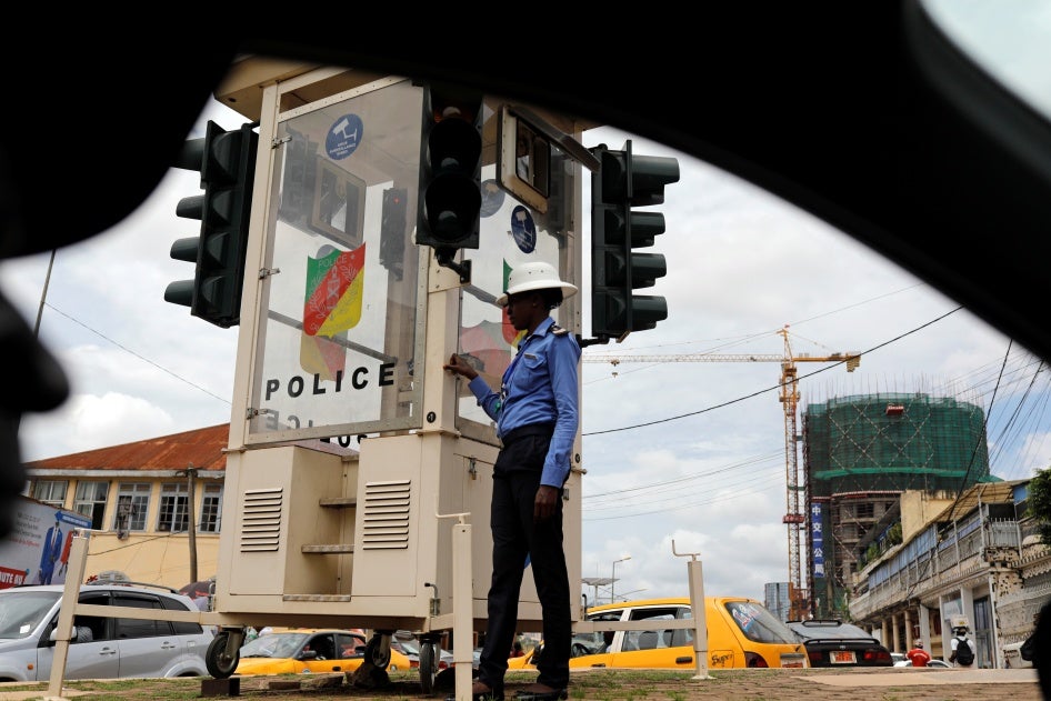 A traffic policewoman stands in downtown Yaounde, Cameroon, October 9, 2018.