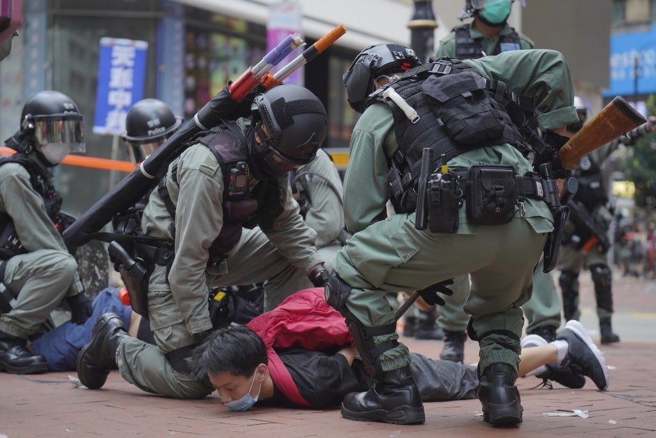 Hong Kong riot police detain a protester during a demonstration against Beijing's national security legislation, Causeway Bay, Hong Kong, May 24, 2020. 