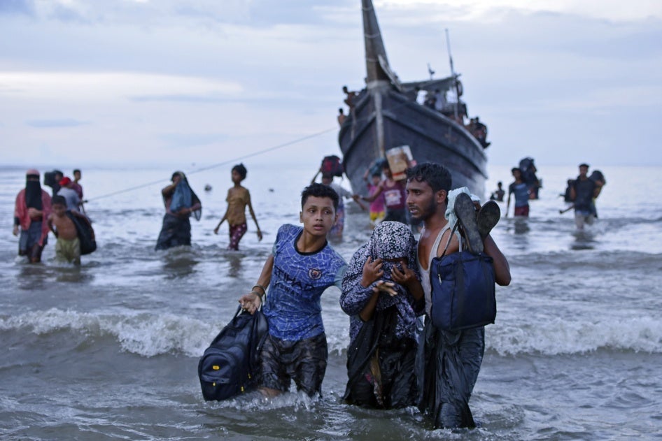 Rohingya asylum seekers disembark from their boat upon landing in Ulee Madon, North Aceh, Indonesia, November 16, 2023.