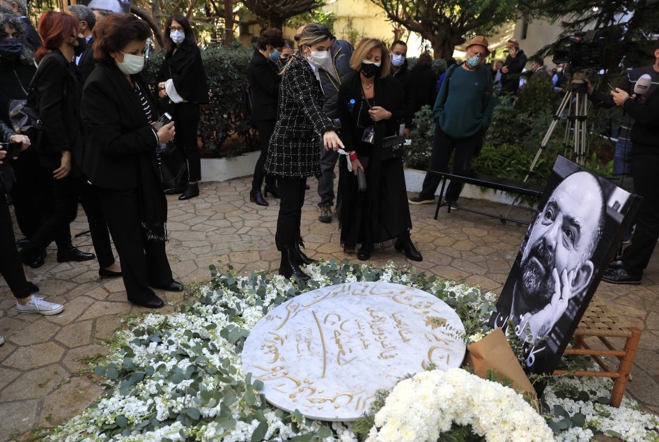 Mourners and activists at a monument for Lokman Slim during his memorial service, Beirut, Lebanon, February 11, 2021.