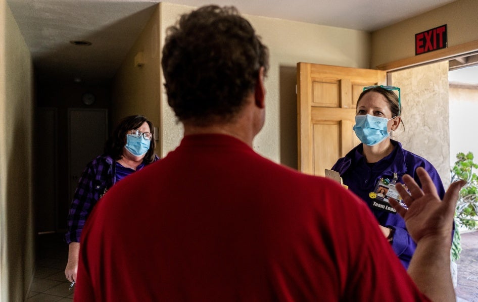 Team leads from the Mobile Crisis Response Teams, an organization that responds to behavioral health, drug, or alcohol-related situations, speak to a client during a call in San Diego, California, March 24, 2023. 