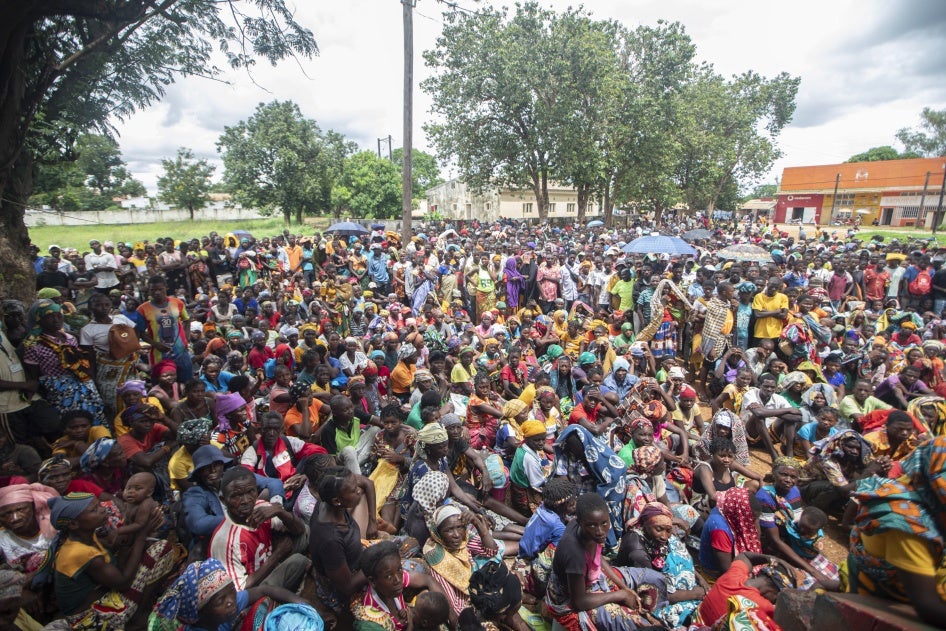Displaced people from the province of Cabo Delgado gather to received humanitarian aid from the World Food Program in Namapa, Mozambique, February 27, 2024. 