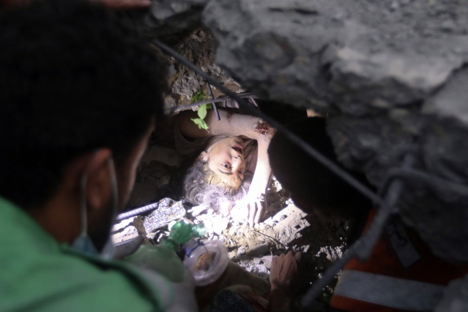 People try to rescue 17-year-old Nada Hisham Jweifel, stuck under the rubble of the Engineers' Building, on October 31, 2023. She was injured, but survived the attack.