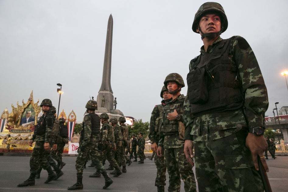 Thai military stand guard during anti-coup protests as Gen. Prayut Chan-ocha receives the Royal Endorsement as the military coup leader in Bangkok, Thailand, May 26, 2014.