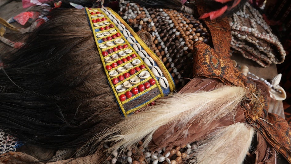 Traditional accessories made from natural materials such as fruits, seeds, shells, and bark foraged from the surrounding forest are commonly used by local residents during cultural events, in Ampera village, Mandobo district, Boven Digoel Regency.