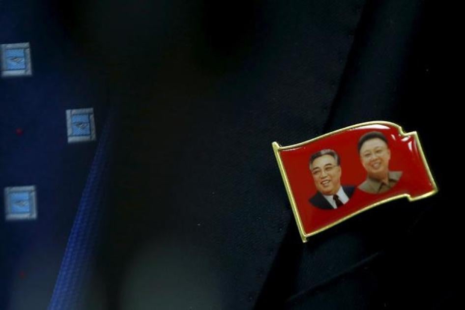 A pin of former North Korean leaders Kim il-Sung and Kim Jong-il is seen on Ri Hung Sik, Ambassador at-large of the North Korean Foreign Ministry during a news conference at the North Korean Mission to the United Nations in New York on November 17, 2015. 