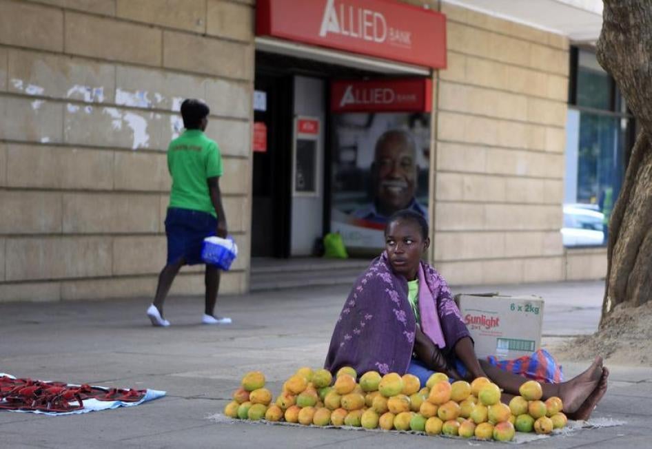 A Zimbabwean fruit vendor waits for customers in central Harare on January 9, 2015. 