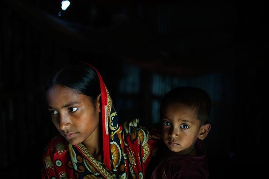 Belkis, 15 years old, holds her one-year-old son in her mother’s house which she returned to after the husband she was married to at age 13 abandoned her. 