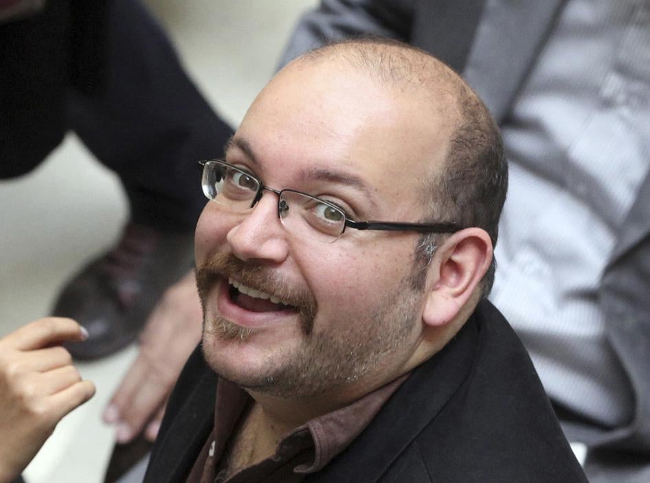 Jason Rezaian, an Iranian-American correspondent for the Washington Post, smiles as he attends a presidential campaign of President Hassan Rouhani on April 11, 2013 in Tehran, Iran. 