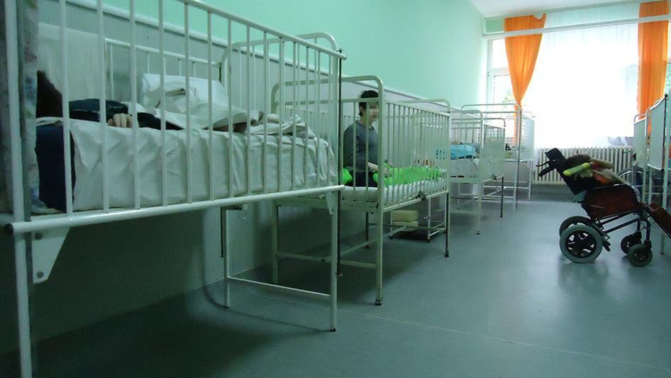 Children with disabilities housed in their cots/dormitories in an institution in Serbia. 