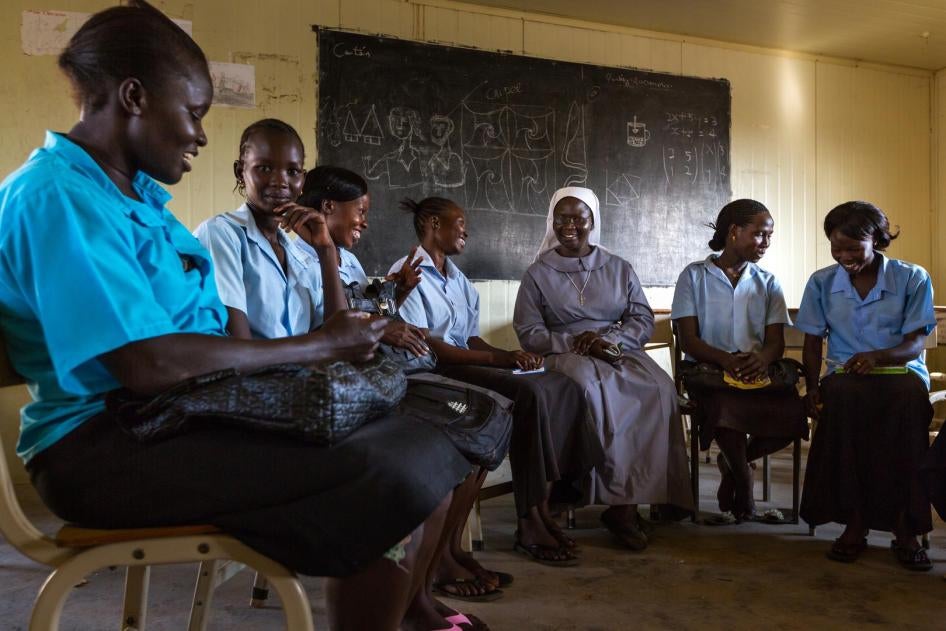 Sister Felicita Humwara, the head of history and religious studies at Juba Day Secondary School, offers support and encouragement to young mothers who have returned to school after having children. 