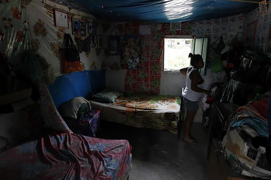 A woman, who is planning to travel without documents to the United States, in her home in the village of Suyatal, outside Tegucigalpa, Honduras, on June 25, 2014. 