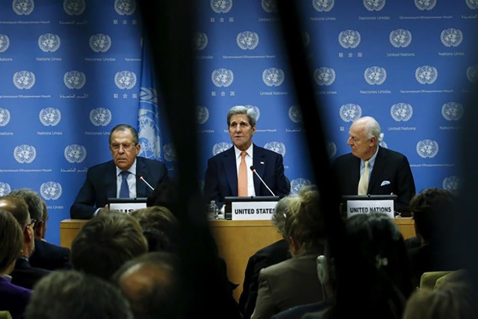U.S. Secretary of State John Kerry speaks to the media next to Russia's Foreign Minister Sergey Lavrov and Special Envoy of the Secretary-General for Syria Staffan de Mistura during a news conference at the United Nations Headquarters in New York on Decem