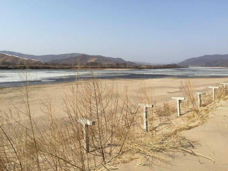 A barbed-wire fence separating North Korea from China is seen in this photo taken from the Chinese border city of Hunchun, China on March 18, 2015.