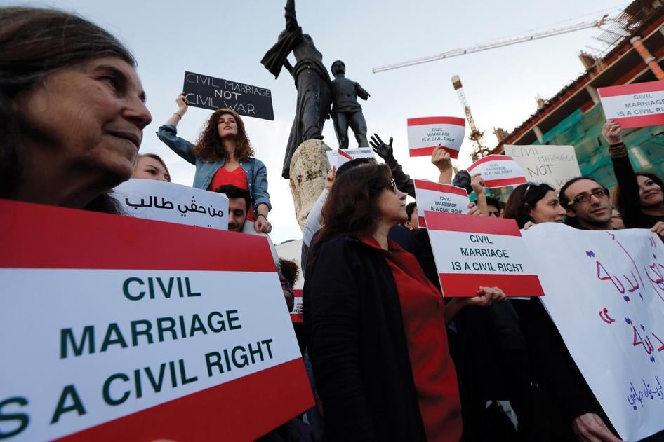 Activists hold placards during a protest demanding civil marriage in Lebanon. There is currently no Lebanese civil personal status law.