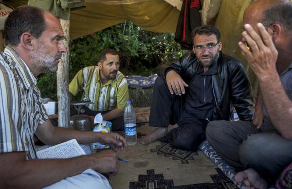 Peter Bouckaert, emergencies director, interviews refugees from the conflict in Syria at the Turkish border in July 2011.