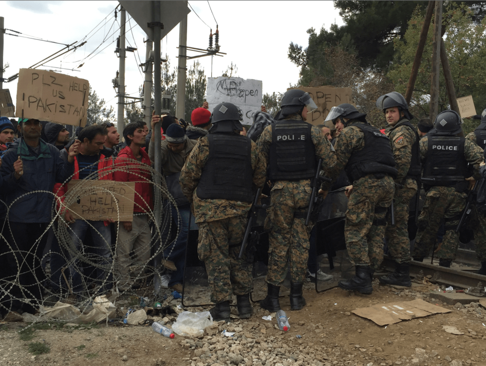 Asylum seekers and migrants protest in front of Macedonian police at Macedonia¹s refusal to allow people who are not Syrian, Afghan or Iraqi to enter the country from Greece. November 22, 2015