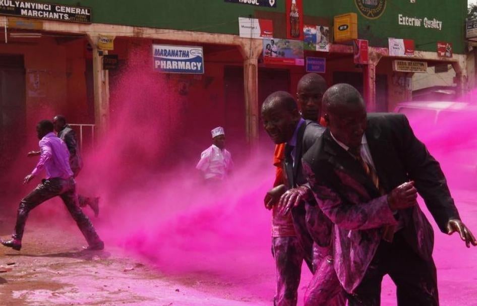 Ugandan police fire teargas and watercannons to disperse opposition supporters who had gathered in a Kampala suburb on August 17, 2011 to mourn people killed during demonstrations.