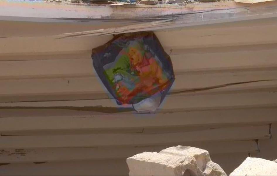 A poster of the children’s books characters, Winnie the Pooh and Eeyore, still hanging amid the destruction of the al-Ibbi home. 