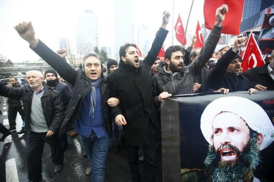Protesters carry posters of Sheikh Nimr al-Nimr during a demonstration in front of Saudi Arabia's Consulate in Istanbul, Turkey.