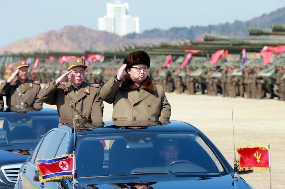 North Korean leader Kim Jong Un salutes as he arrives to inspect a military drill at an unknown location, in this undated photo released by North Korea's Korean Central News Agency (KCNA) on March 24, 2016. 