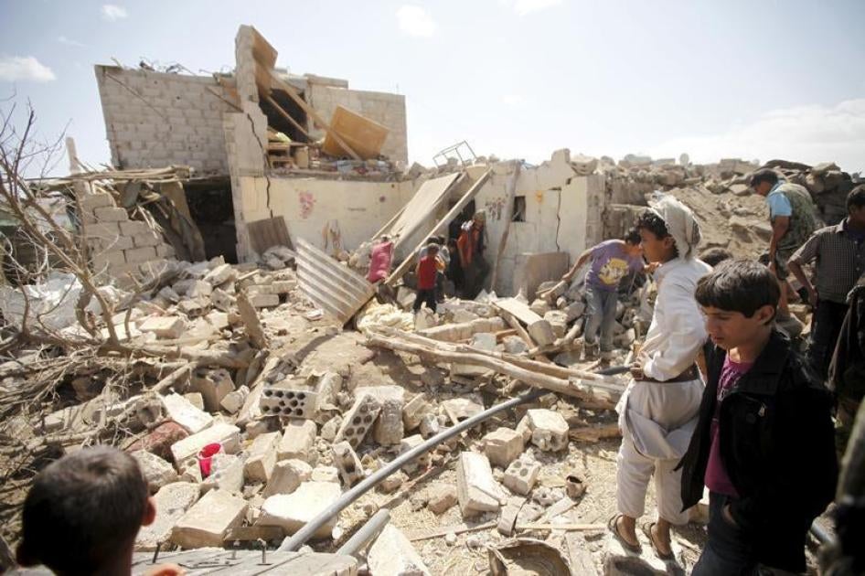 People inspect damage at a house after it was destroyed by a Saudi-led air strike in Yemen's capital Sanaa, February 25, 2016. 