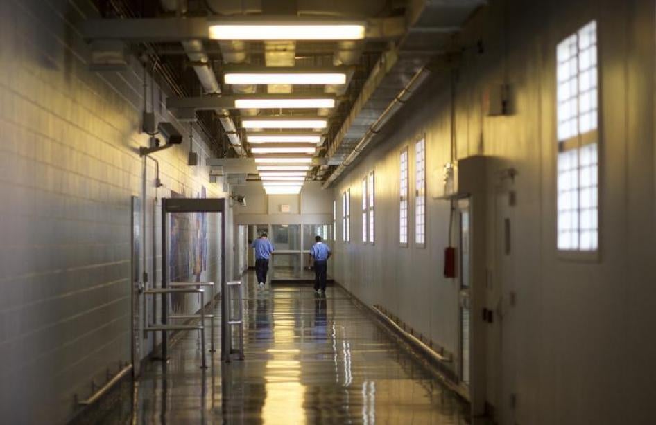 Inmates walk the hallways during a media tour of the Curran-Fromhold Correctional Facility in Philadelphia, Pennsylvania, August 7, 2015. 