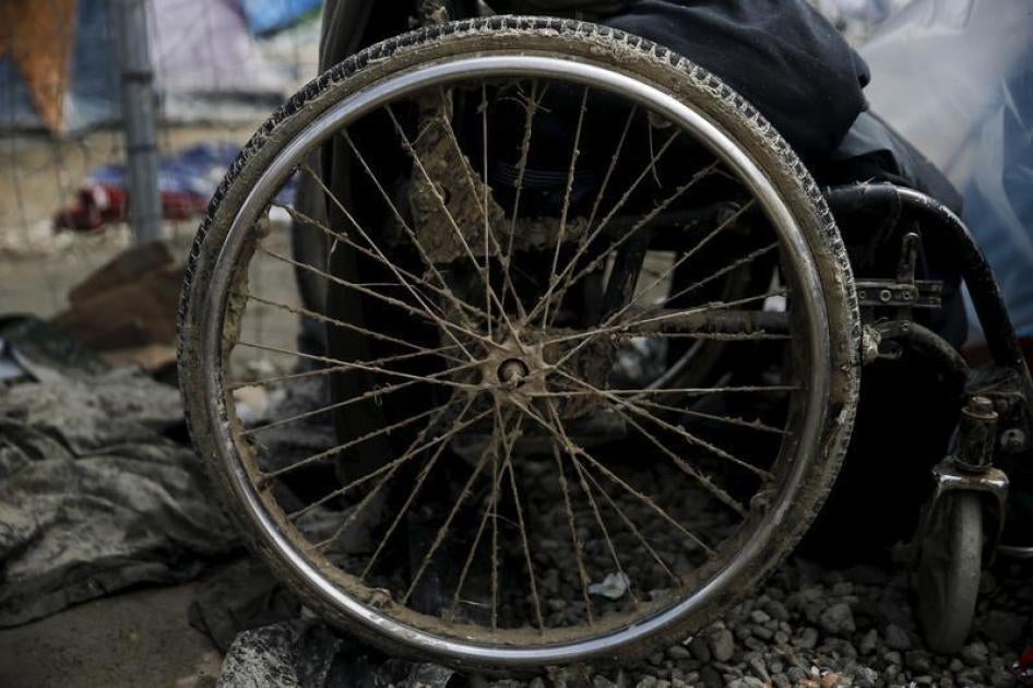 Mud covers the deflated wheel of an Iraqi refugee’s wheelchair outside his tent at a makeshift camp for refugees and migrants at the Greek-Macedonian border near the village of Idomeni, Greece, March 17, 2016.