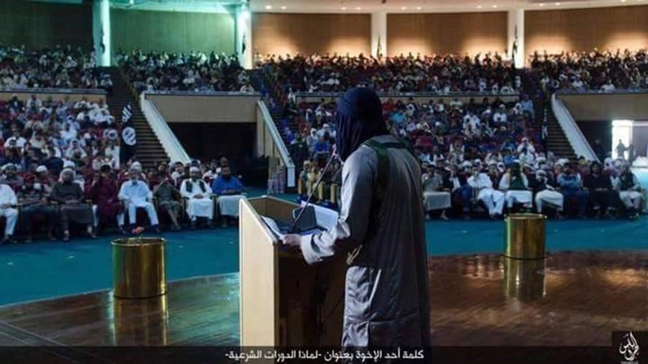 An ISIS lecture on Sharia (Islamic law) at the Ouagadougou complex in Sirte, Libya, where former Libyan leader Muammar Gaddafi once hosted summits with world leaders. The caption in Arabic reads: “Speech by one of the brothers (why we are holding Sharia s