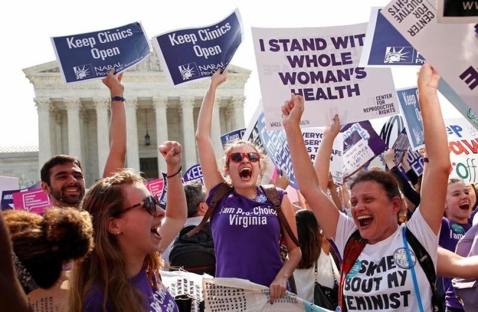 Demonstrators celebrate at the U.S. Supreme Court after the court struck down a Texas law imposing strict regulations on abortion doctors and facilities that its critics contended were specifically designed to shut down clinics in Washington June 27, 2016