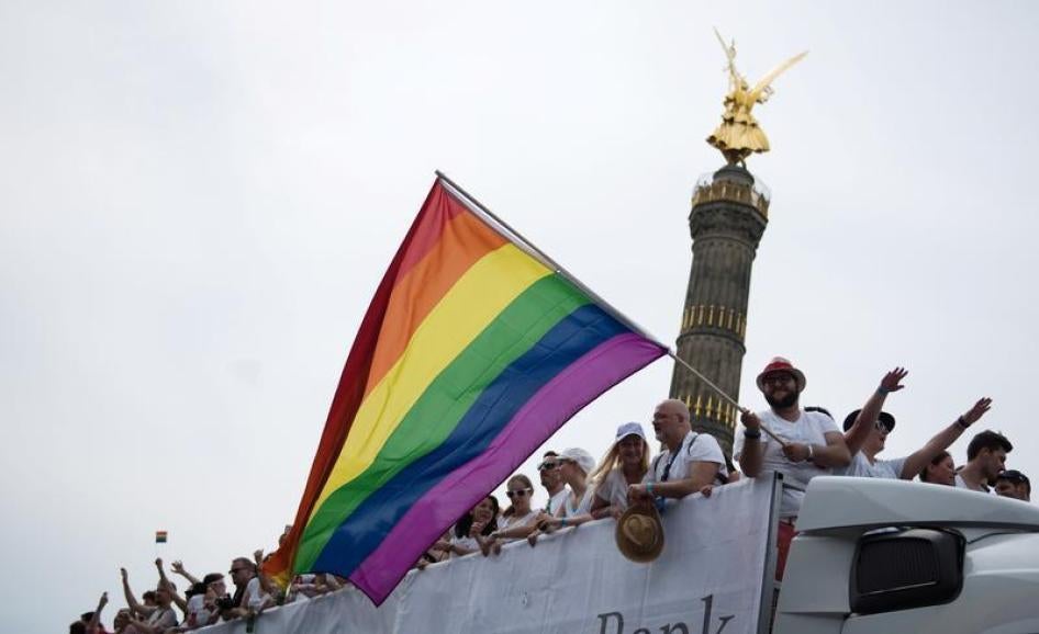 People dance in front of the Victory column as they participate in the annual Gay Pride parade, also called Christopher Street Day parade (CSD), in Berlin, Germany July 23, 2016.