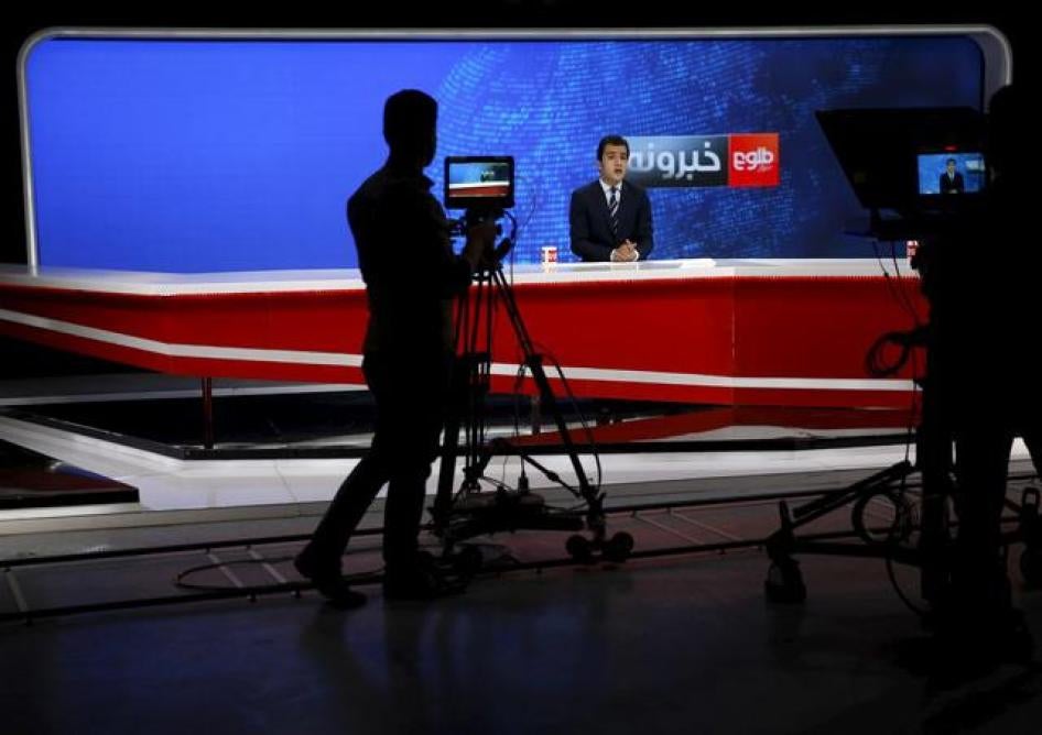 A cameraman films a news anchor at Tolo TV studio in Kabul, Afghanistan on October 18, 2015.