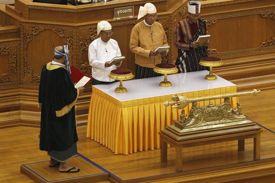 Myanmar's first Vice President Myint Swe, President Htin Kyaw, and second Vice President Henry Van Thio attend their swearing-in at parliament in Naypyidaw on March 30, 2016. 