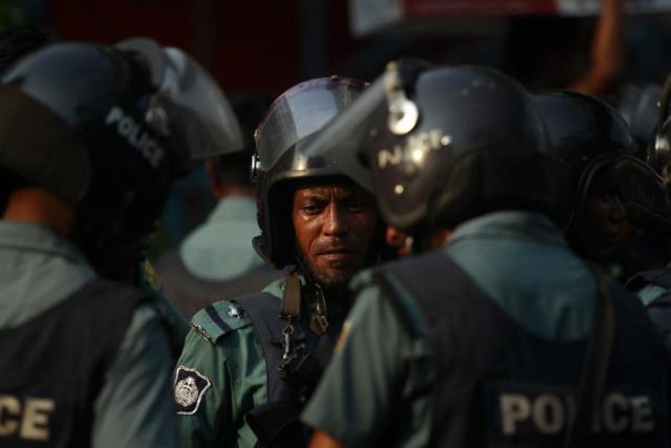 Police stand guard during a rally by activists demanding capital punishment for a group of bloggers in Dhaka, Bangladesh on April 12, 2013.