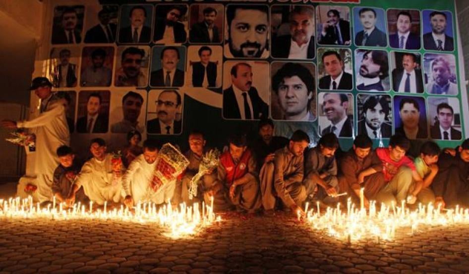 People hold a candlelight vigil for those killed in the August 8, 2016 blast in Quetta, Pakistan.