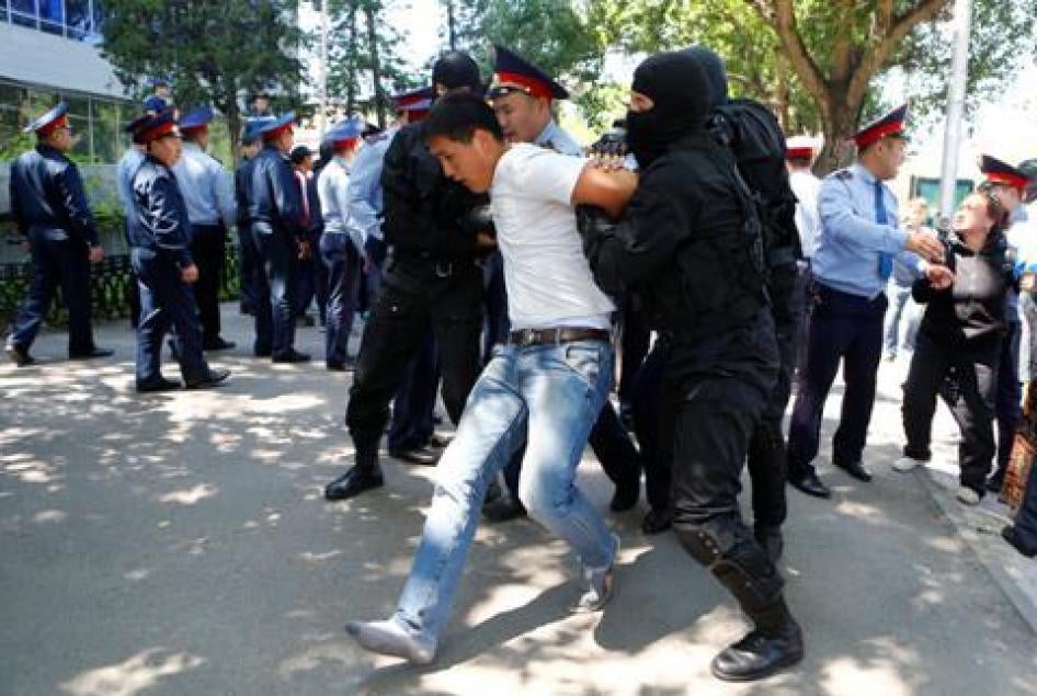 Riot police officers detain demonstrators during a protest in Almaty, Kazakhstan on May 21, 2016.