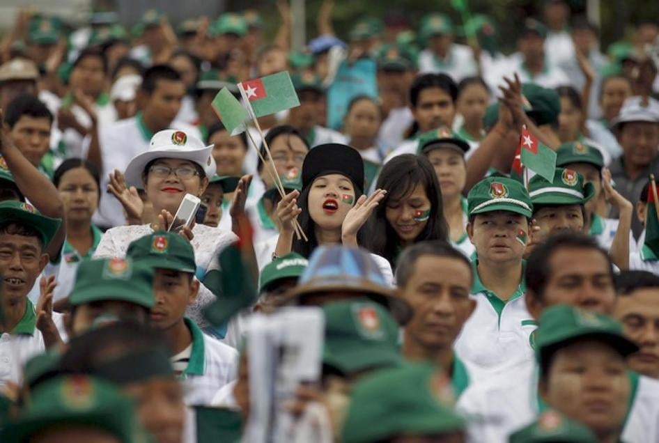 Supporters react during a a ruling Union Solidarity and Development Party (USDP) campaign rally in Rangoon, Burma on October 10, 2015.